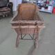 Landau vintage in wicker and brown wood, 1930s, large wheels and metal structure.