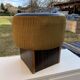 Black hexagonal pouf in fabric and faux leather, mid-century Hungarian ottoman from the 1950s.