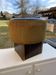 Black hexagonal pouf in fabric and faux leather, mid-century Hungarian ottoman from the 1950s.