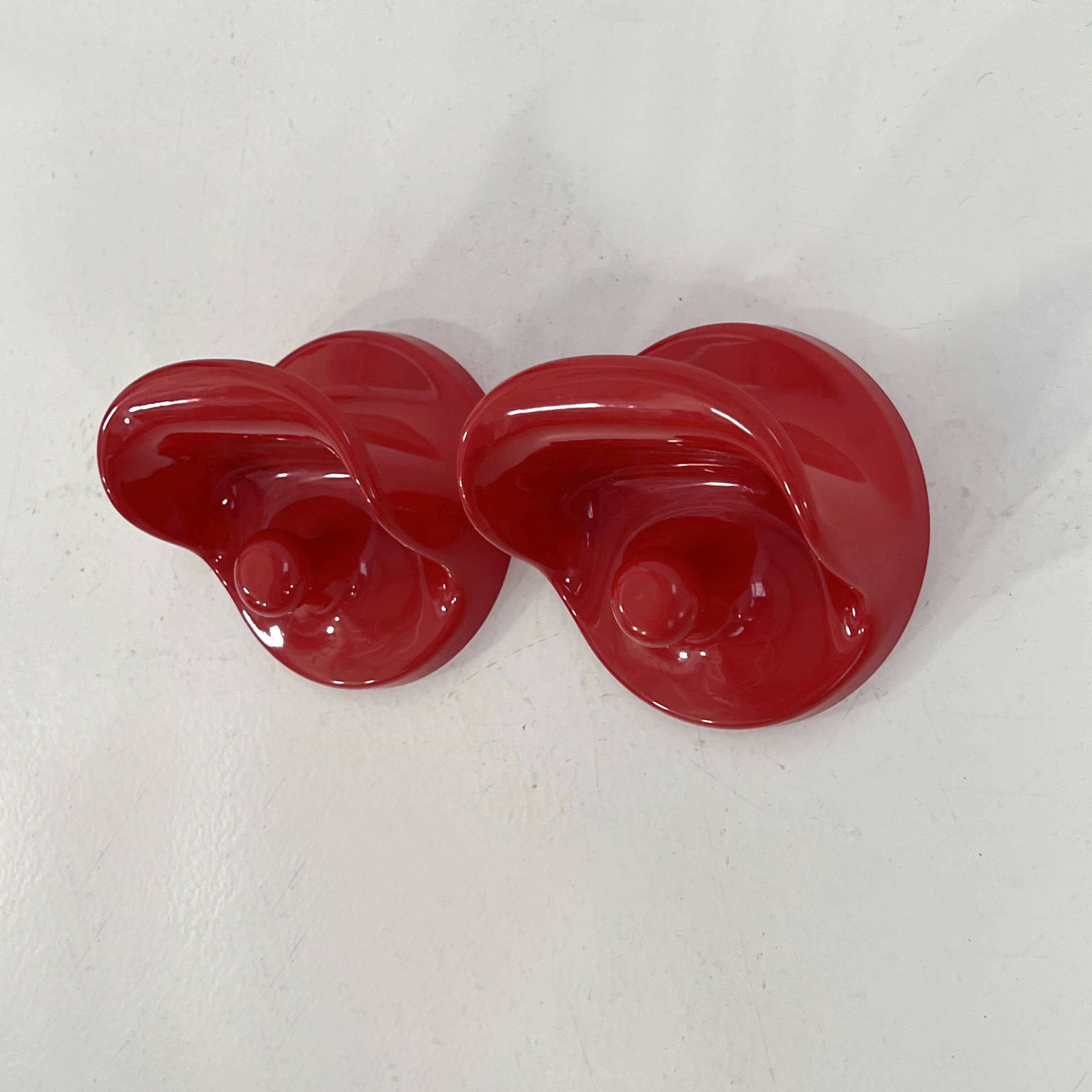 Set of 2 red "gancio 4702" coat hooks by olaf von bohr for kartell, 1970.