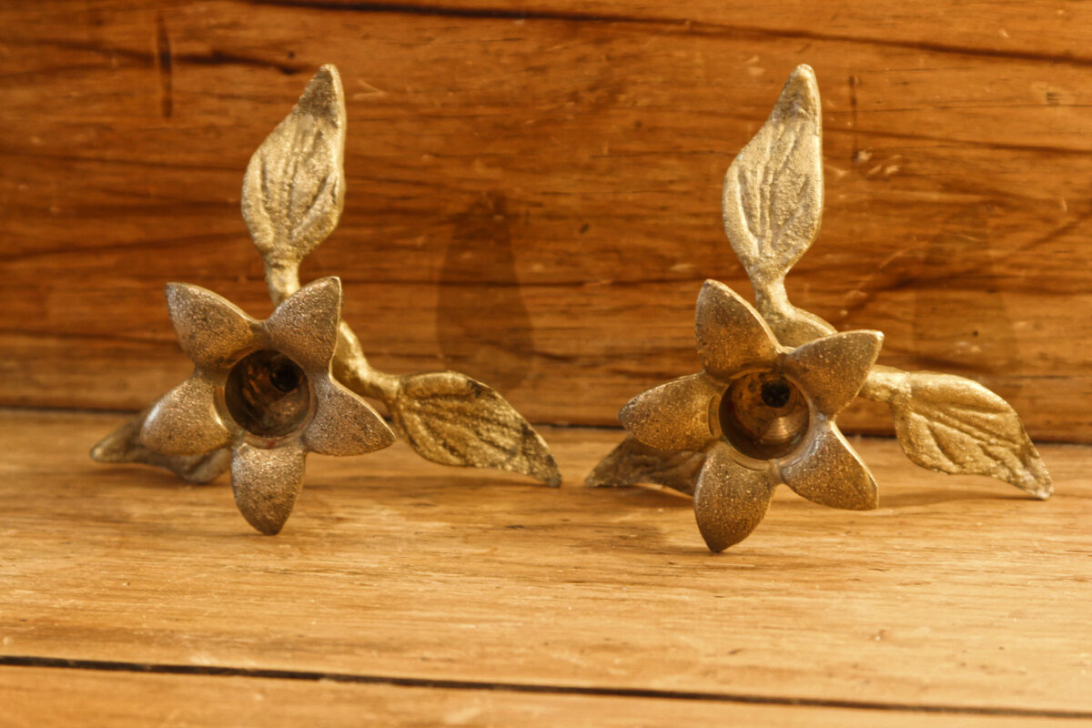 Pair of brass candle holders, flowers
