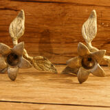 Pair of brass candle holders, flowers