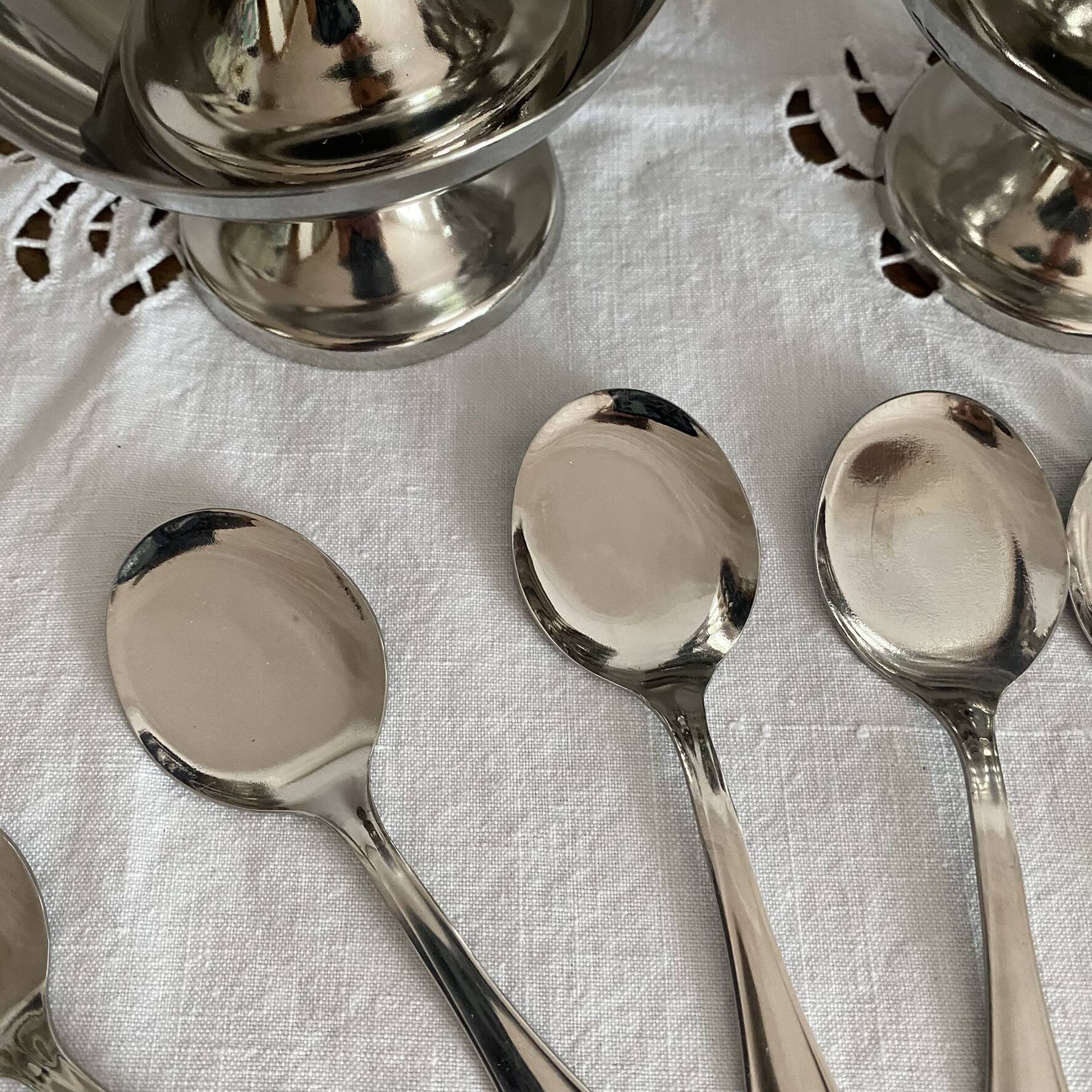 Stainless steel ice cream cups and spoons, 1960s-70s, original boxes.