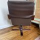 1970s Scandinavian armchair in curved laminated wood with a leather seat.