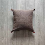 Moroccan brown cushion with cotton pompom