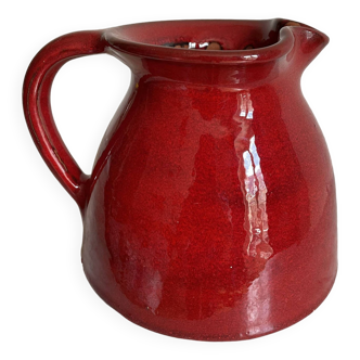Red enameled ceramic pitcher