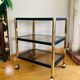 Side table in gold metal and smoked glasses 1970s