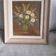An old painting in oil on canvas depicting a bouquet of flowers.