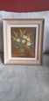 An old painting in oil on canvas depicting a bouquet of flowers.