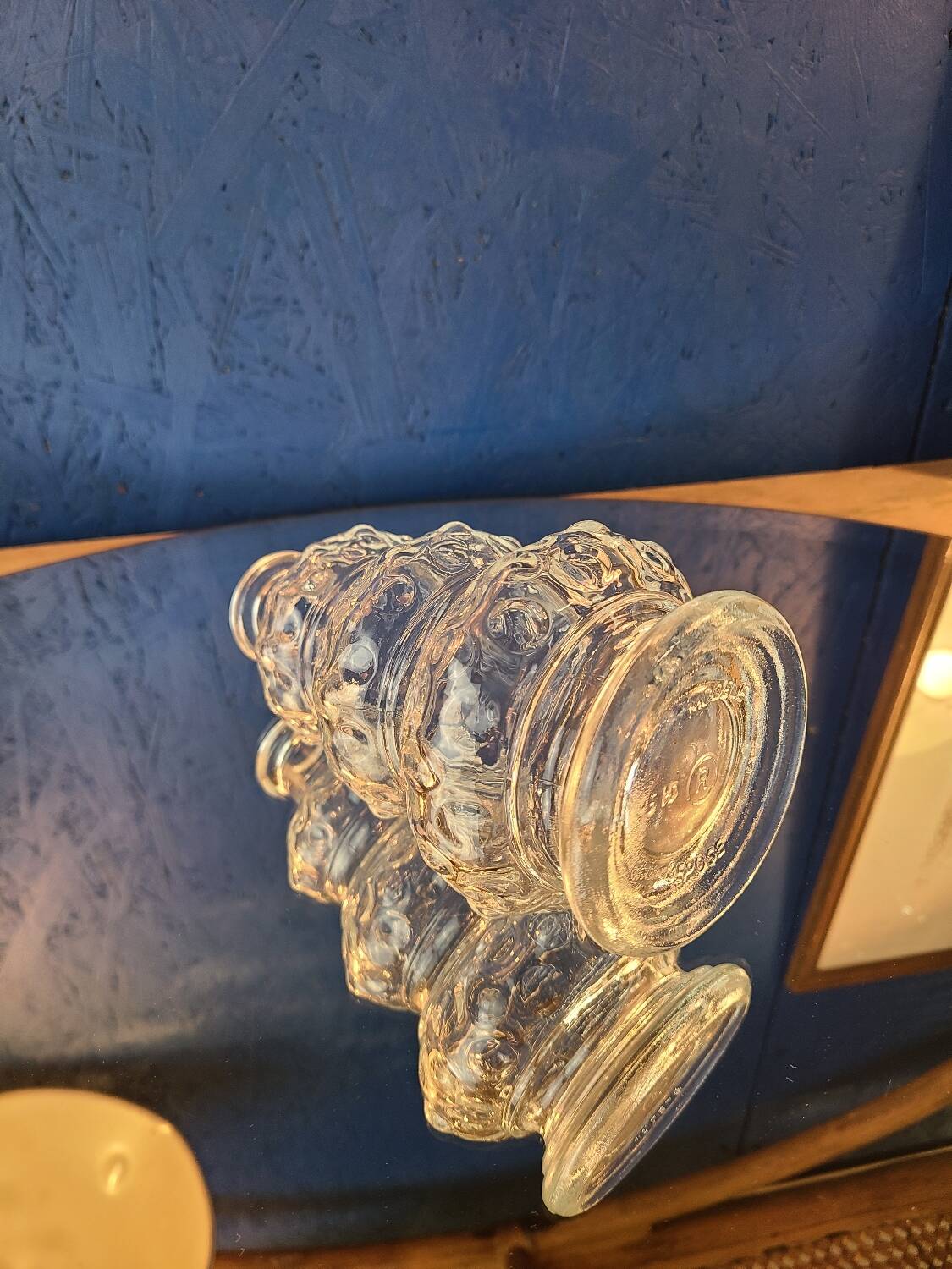 Old 3-branched stone candlestick cut with fine engravings