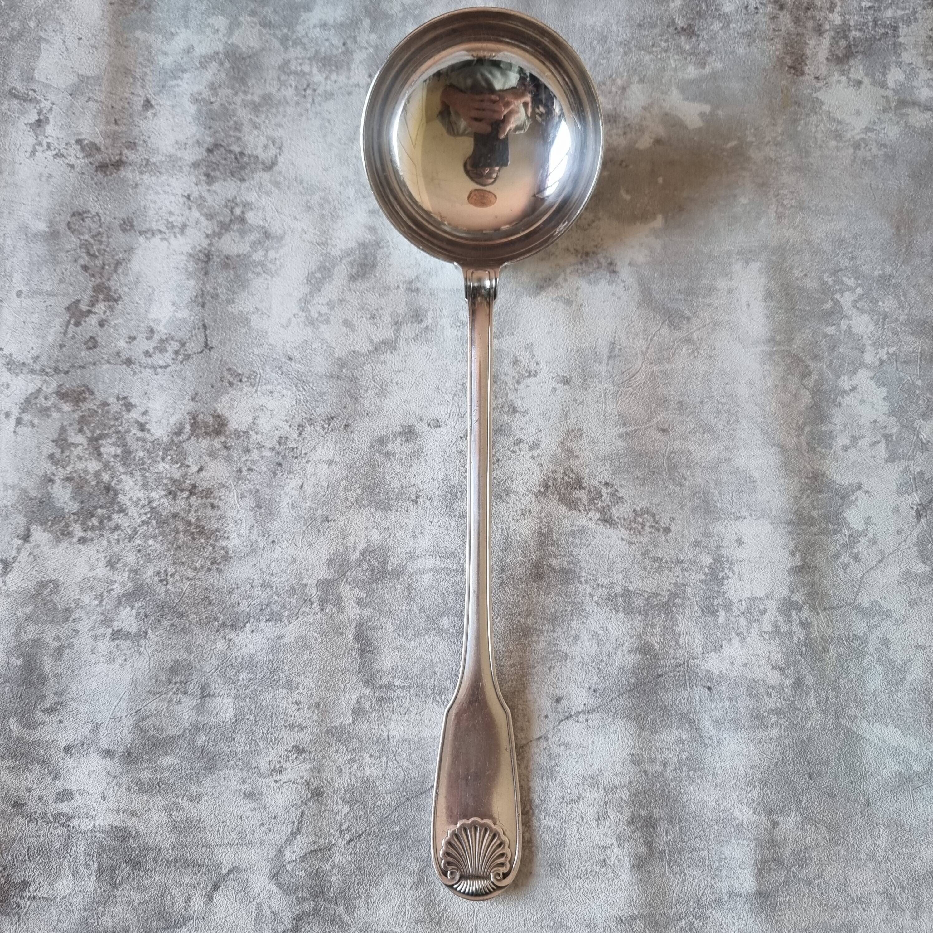 The Christofle silver-plated “Vendôme” cream ladle features a design