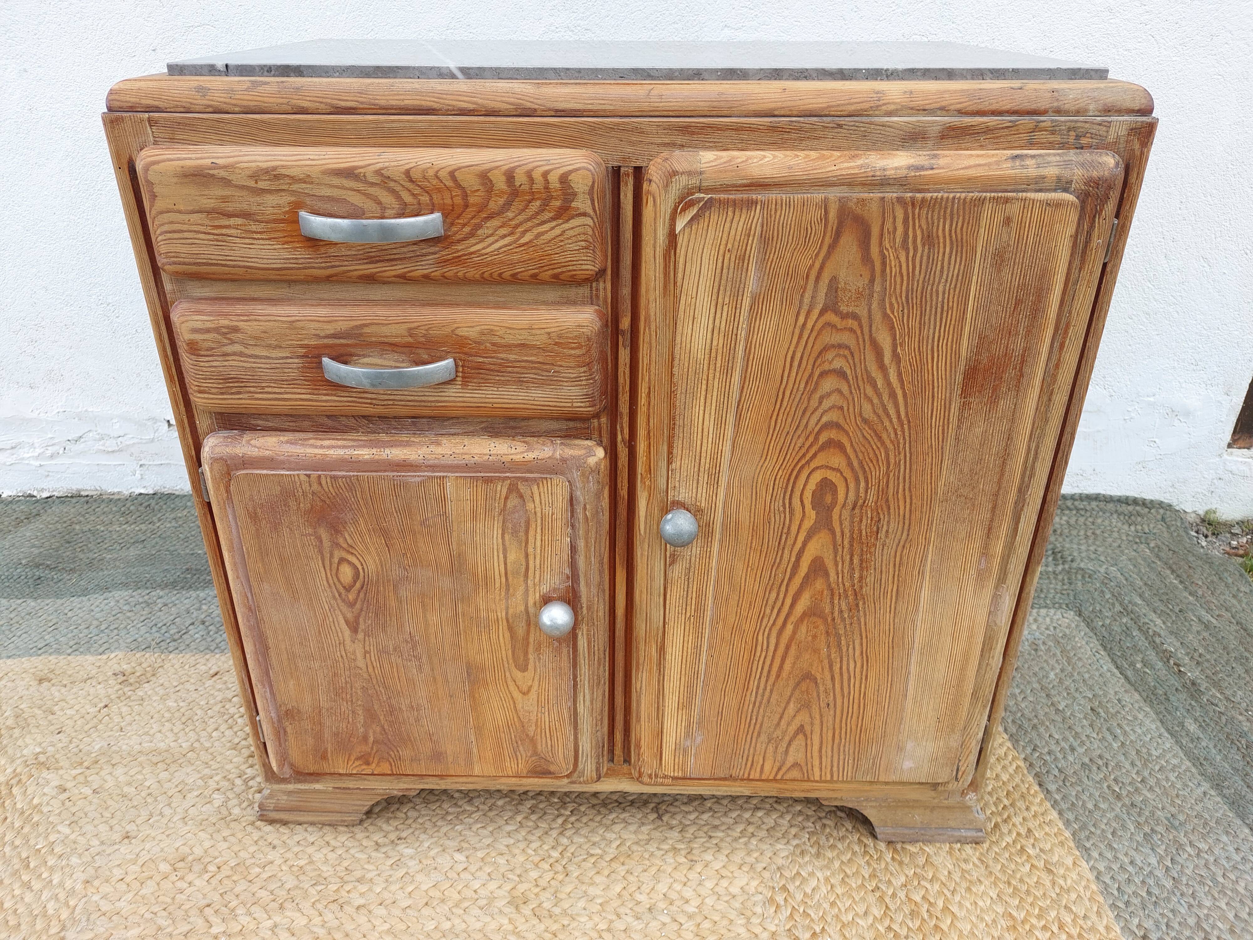Vintage wooden buffet with a marble top.