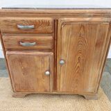 Vintage wooden buffet with a marble top.