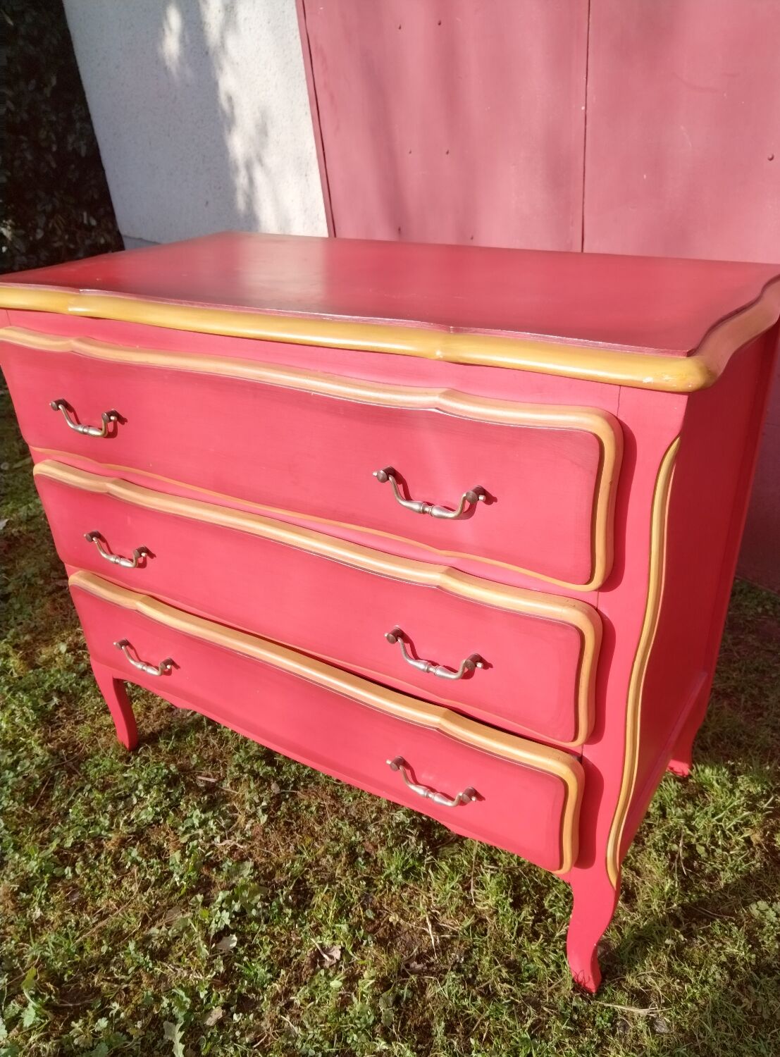 Matte gold and red patinated chest of drawers