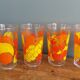Verres vintage décorated with orange and yellow lemon fruits, Italy.
