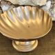 Large brass shell-shaped pocket emptier