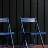 Set of two blue folding chairs