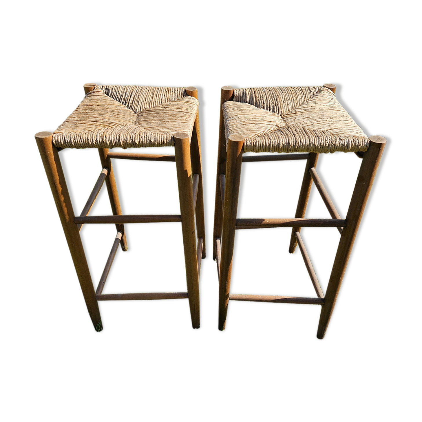 2 high stools sitting straw
