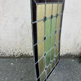 Pair of stained glass windows with geometric patterns late nineteenth century