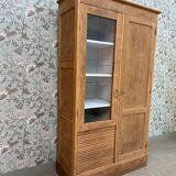 Display cabinet with hanging space
