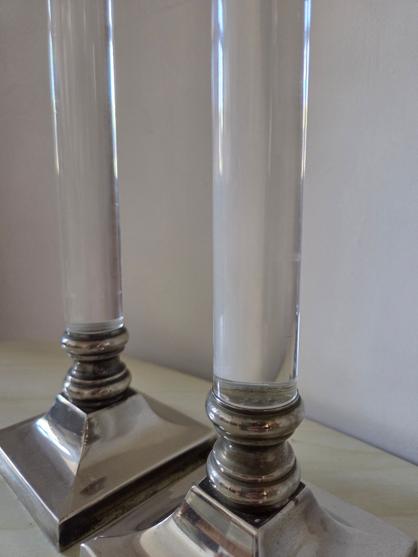 Pair of lucite and silver-plated candlesticks