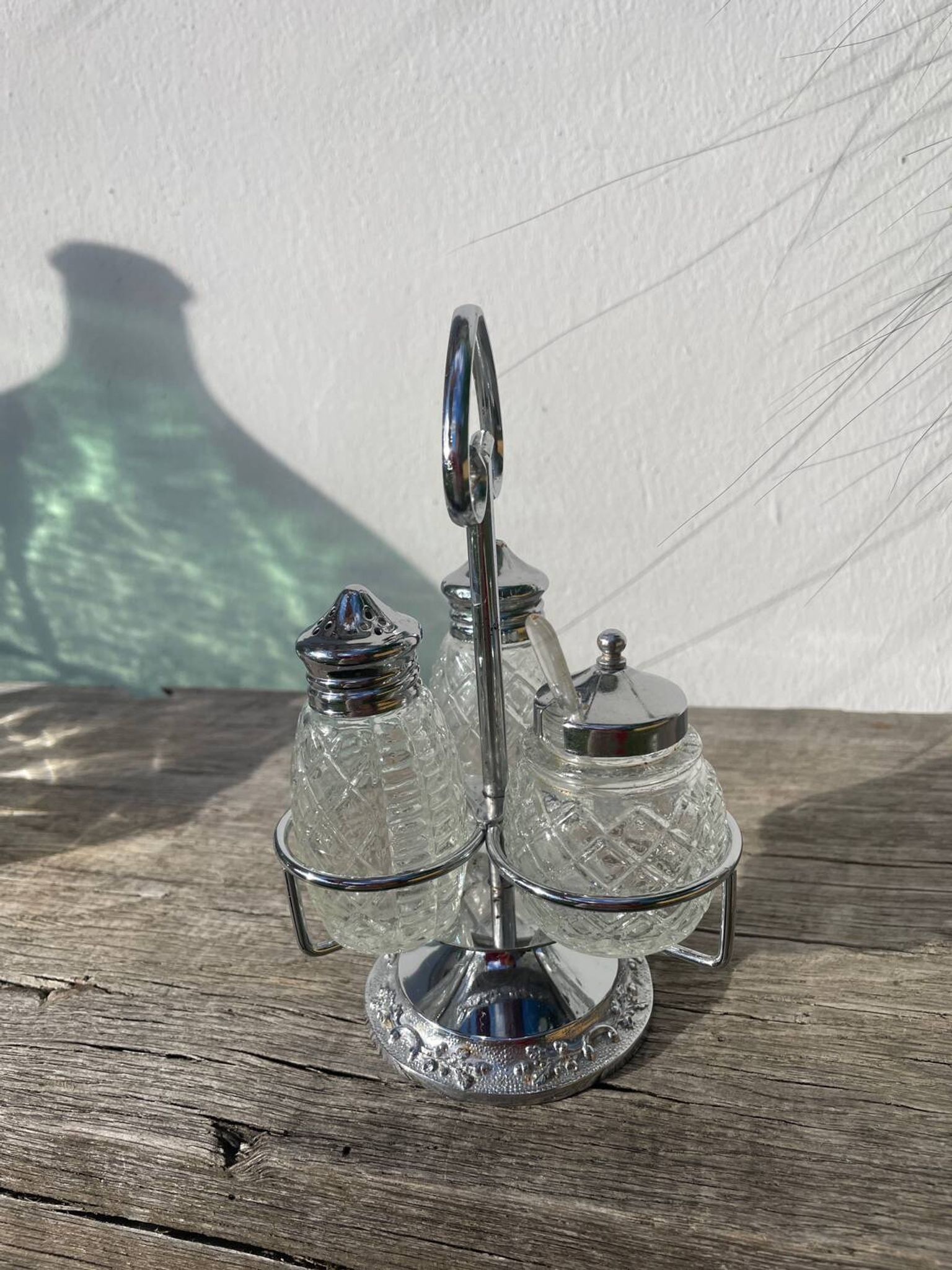 Silver-plated metal and glass salt and pepper shakers