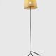 Modernist tripod floor lamp in black metal and cane from the 1950s/1960s.