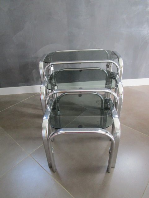 3 Vintage trundle tables in chromed steel and smoked glass