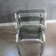3 Vintage trundle tables in chromed steel and smoked glass