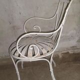 Wrought iron garden armchair with riveted flexible blades early XXth