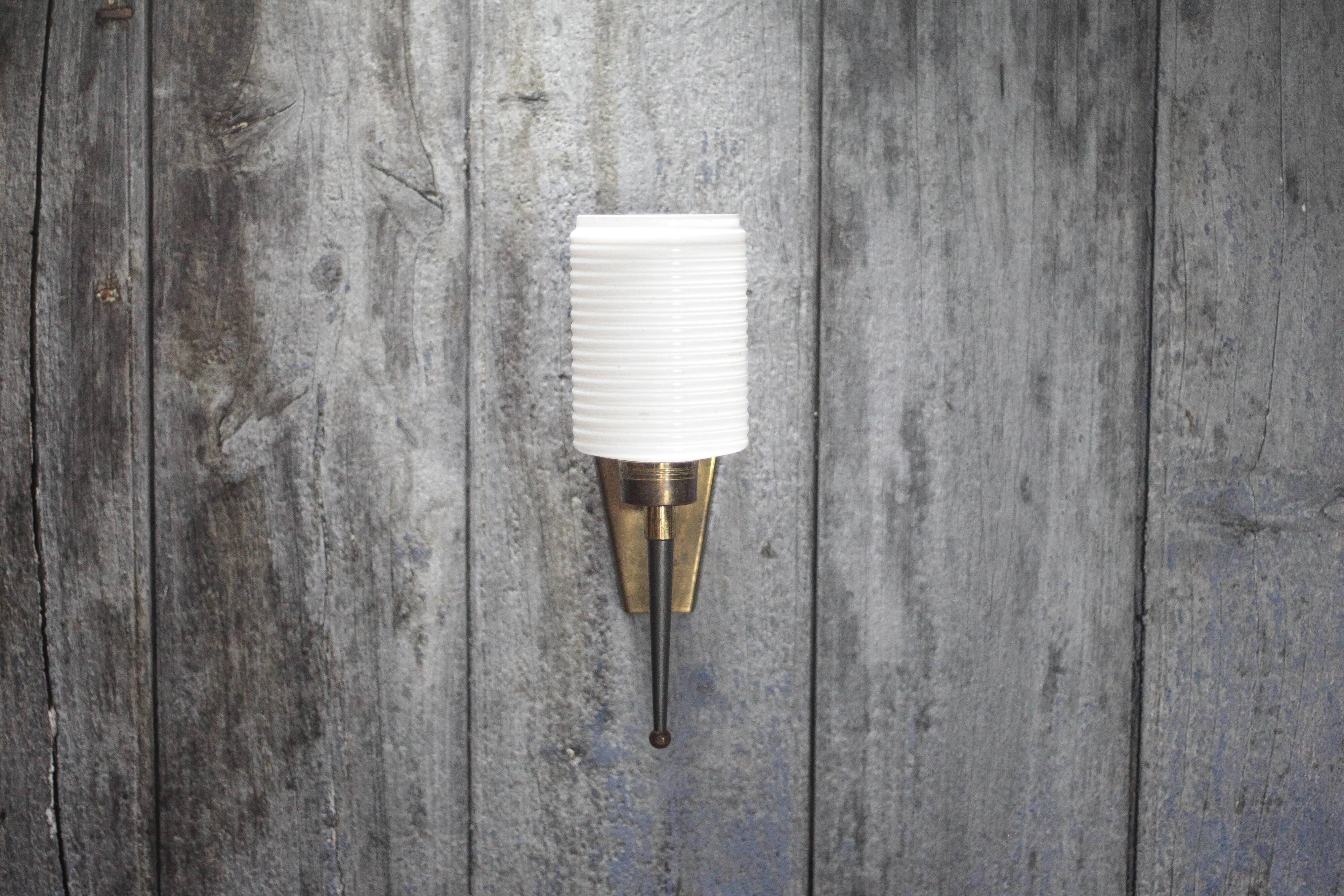Brass wall light, black lacquered metal and white opal glass, 50s.