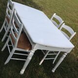 White farmhouse table set and four chairs