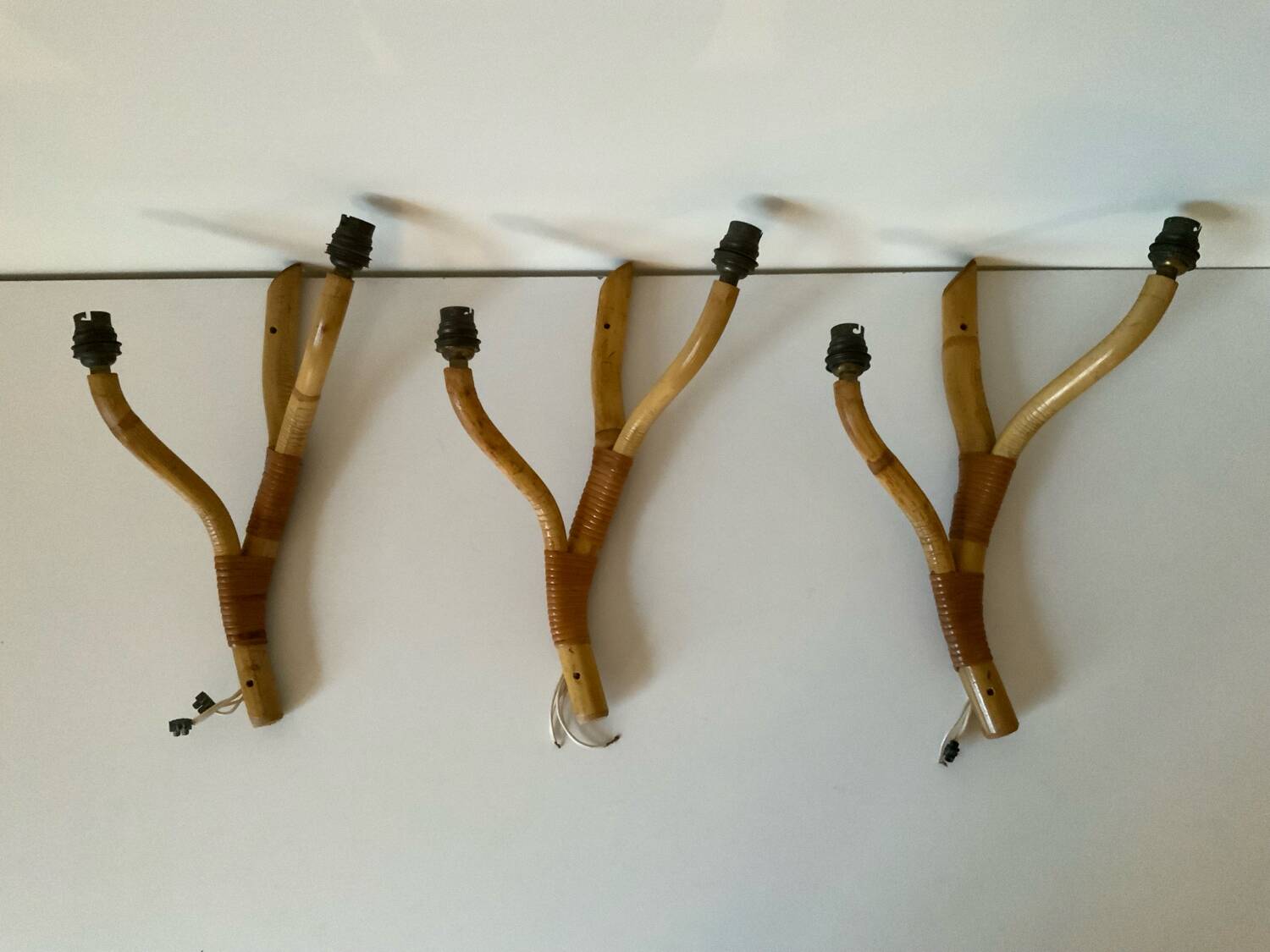 Rattan wall light trio