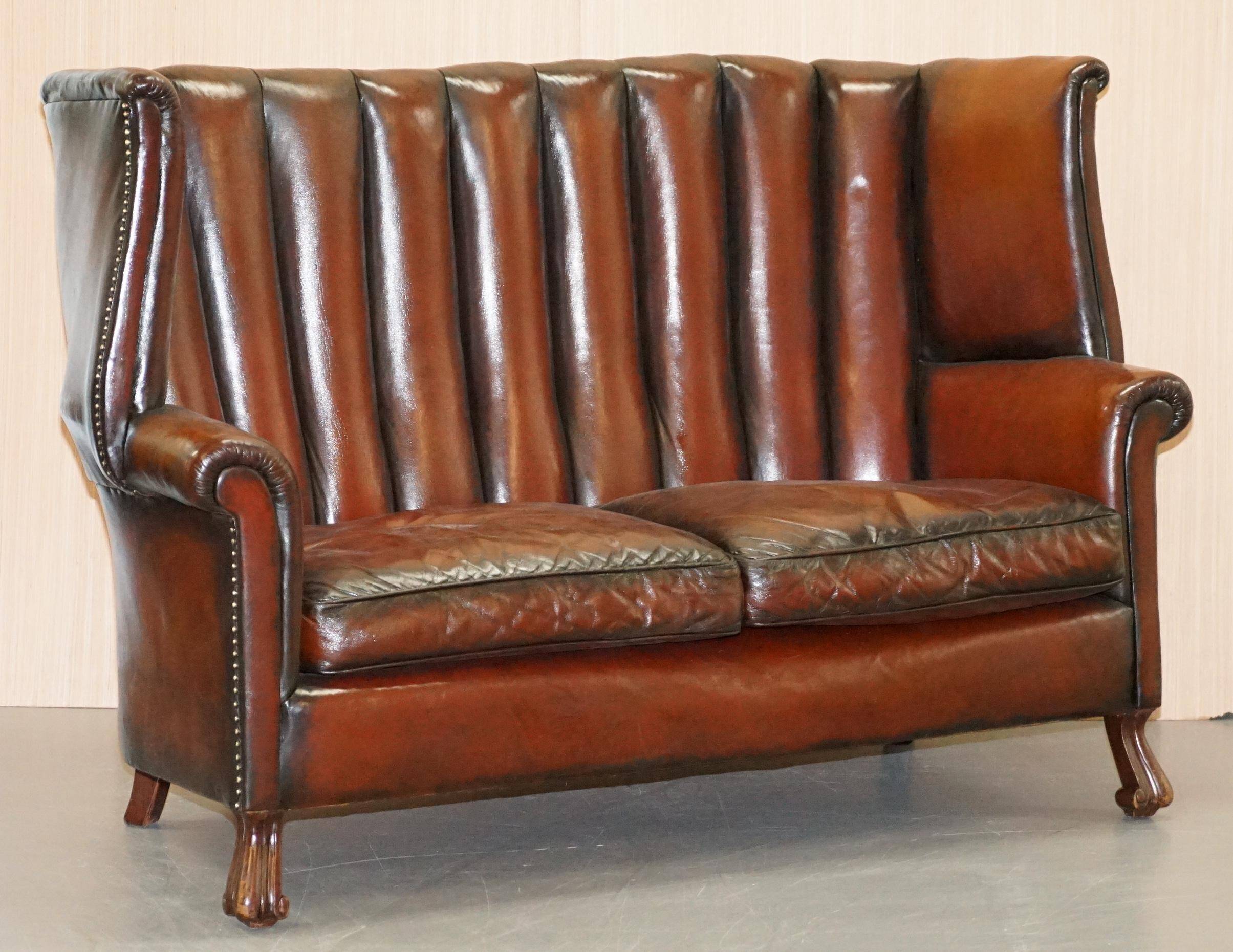 Victorian leather canapé and armchair, barrel back, circa 1860, restored.