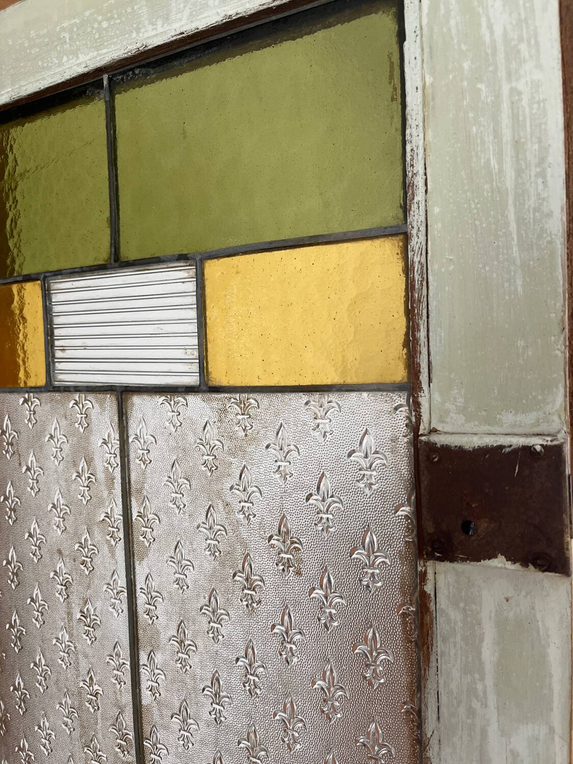 Antique dresser with glass doors and fleur-de-lys from the 50s