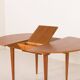Scandinavian round teak table with hidden extension, 1970s