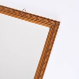 Small old wooden mirror with carved frame