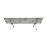 Old perforated metal garden bench