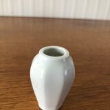 8 miniature vases in white earthenware