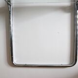 Chrome and glass wall shelf, circa 1960