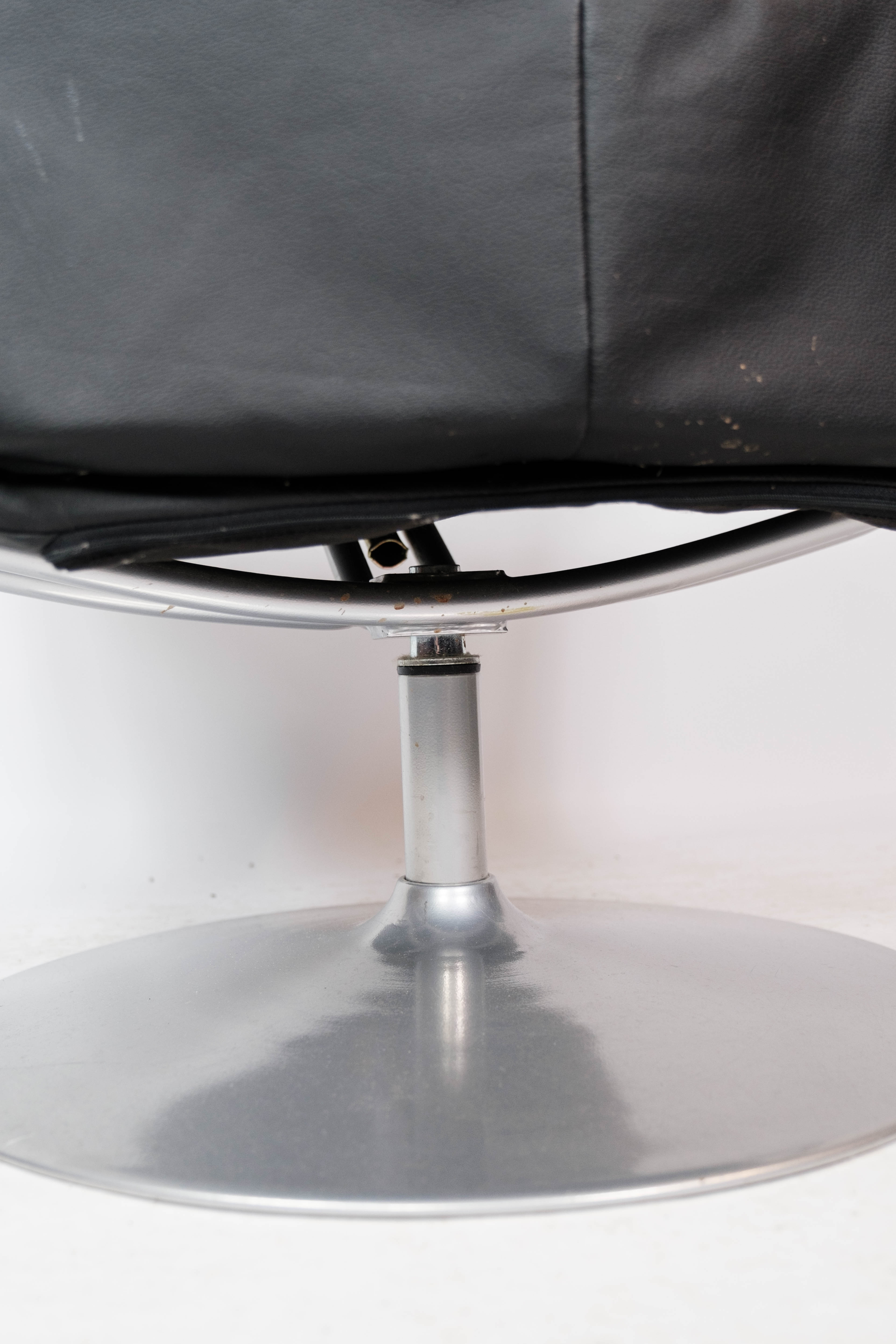 Easy chair with stool upholstered with black leather of Danish design, 1970s