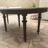 Oval table with extensions in massive mahogany napoleon III era.