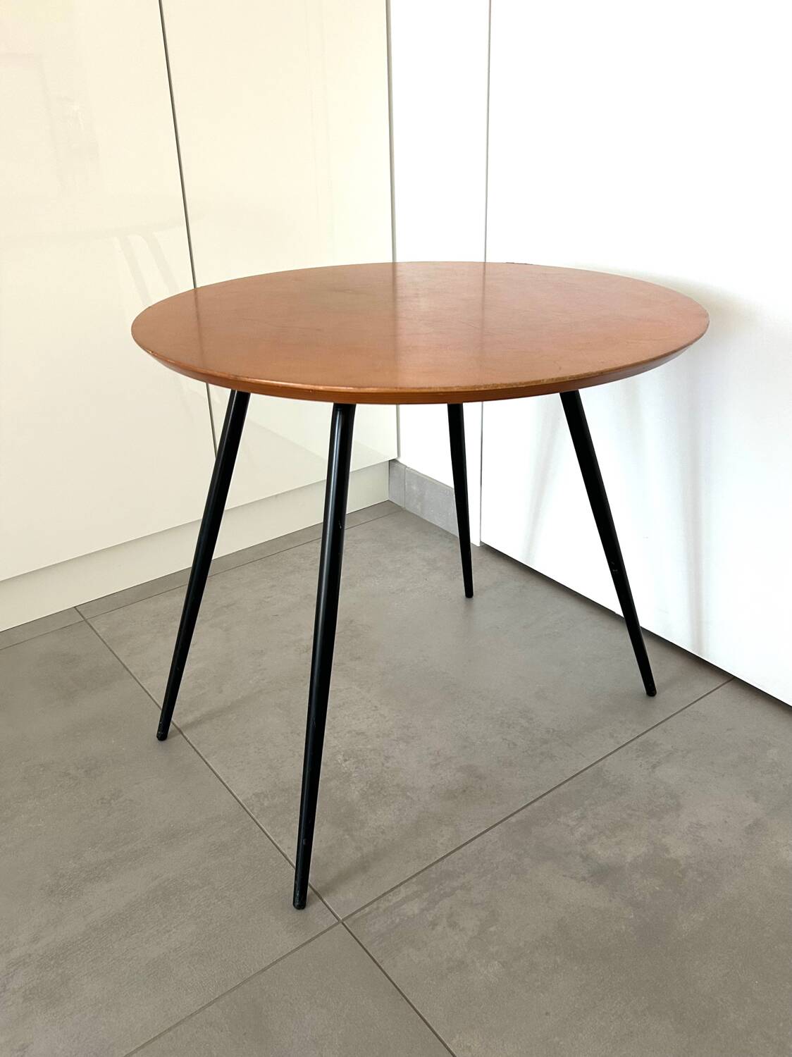 1970s coffee table in honey beech with black steel legs.