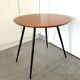 1970s coffee table in honey beech with black steel legs.
