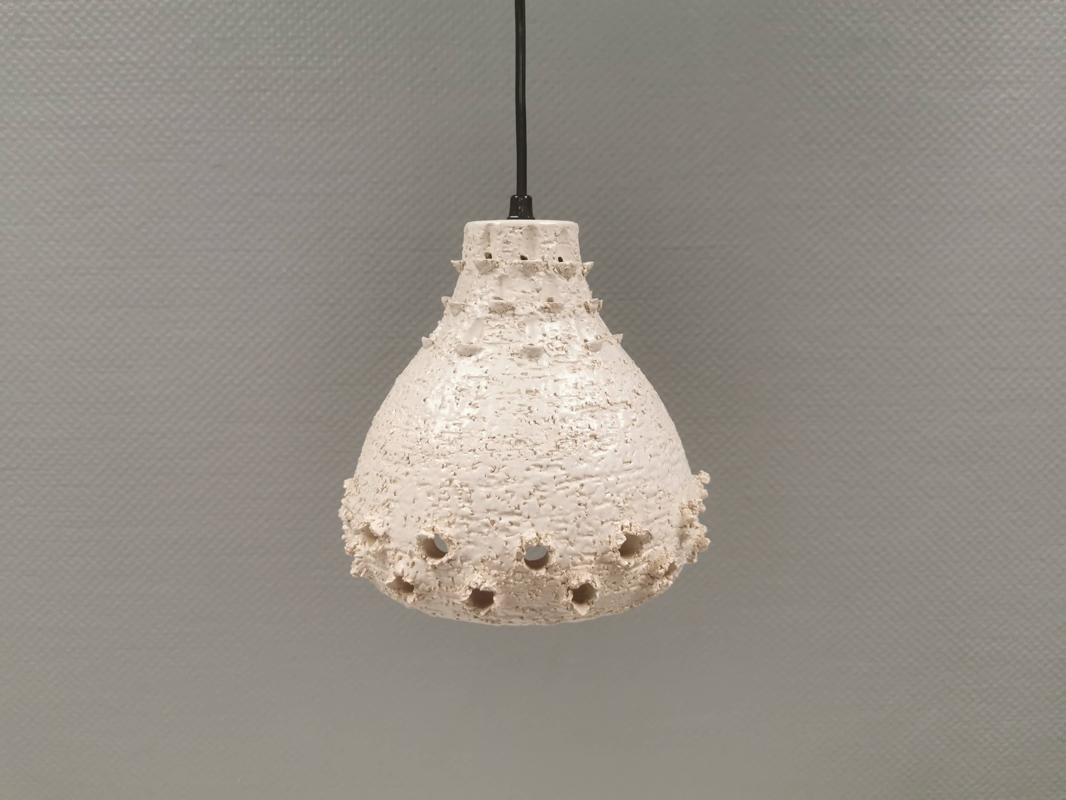 Ceramic hanging lamp in creamy white color that almost looks like a corral