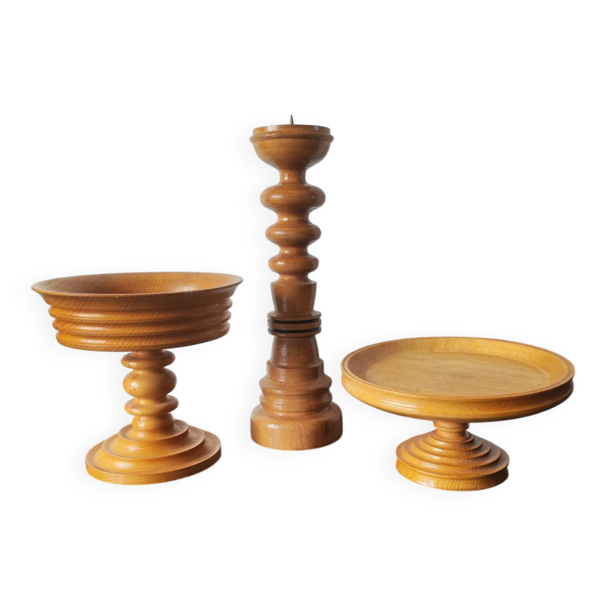 Vintage decor trio: candlestick and light wood bowls in Scandinavian style.