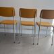 LM vintage chrome and orange/mustard yellow faux leather chairs