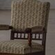 Modern Danish armchair in turned wood with floral fabric, early 20th century.