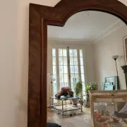 Large curved mirror with a wooden frame