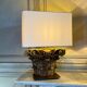 Pair of table lamps, half Corinthian capitals in carved and gilded wood, 18th century